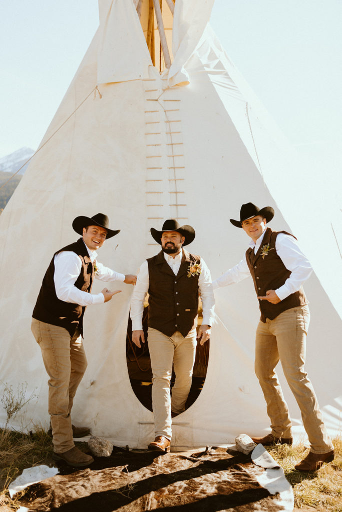 Groom and groomsmen posing for photos before montana paradise valley wedding