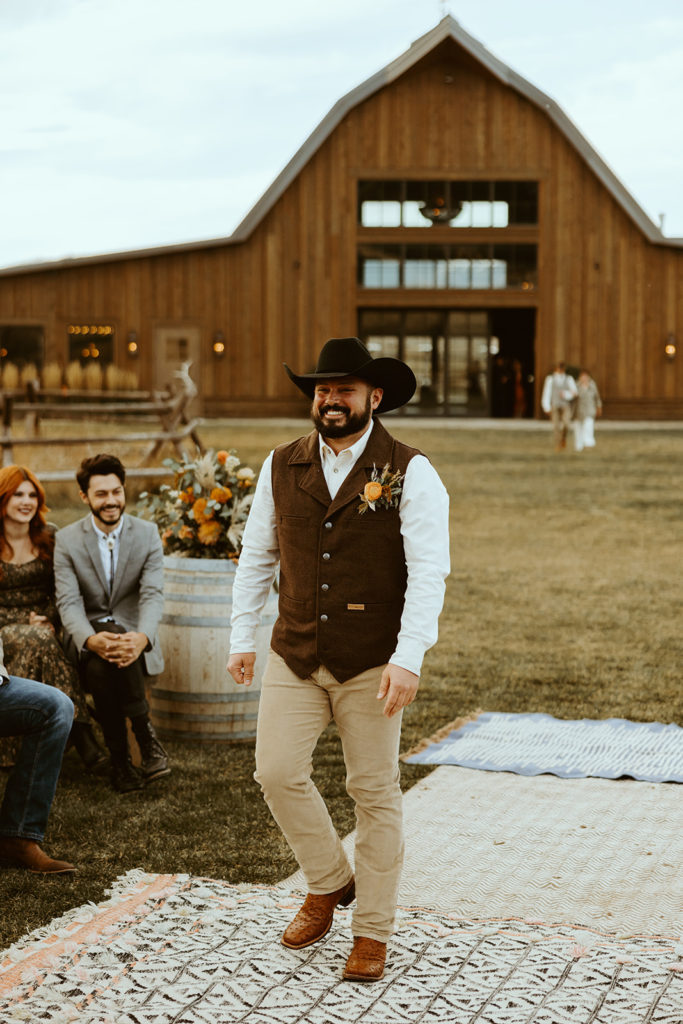 Groom walking to the alter before wedding ceremony in montana paradise valley