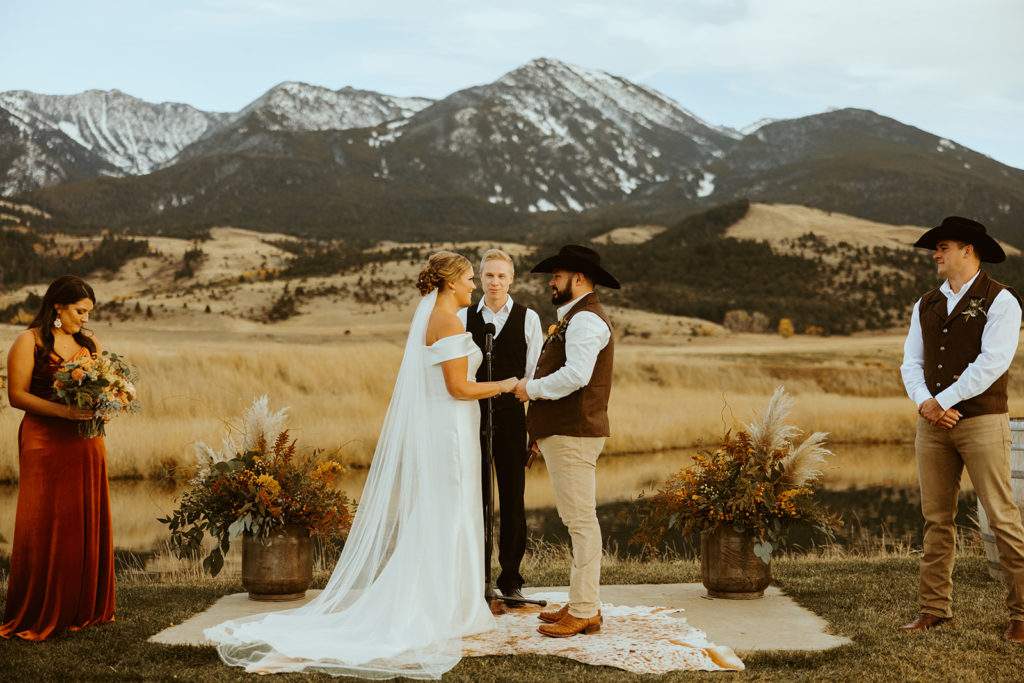 Bride and groom at the altar during montana paradise valley wedding