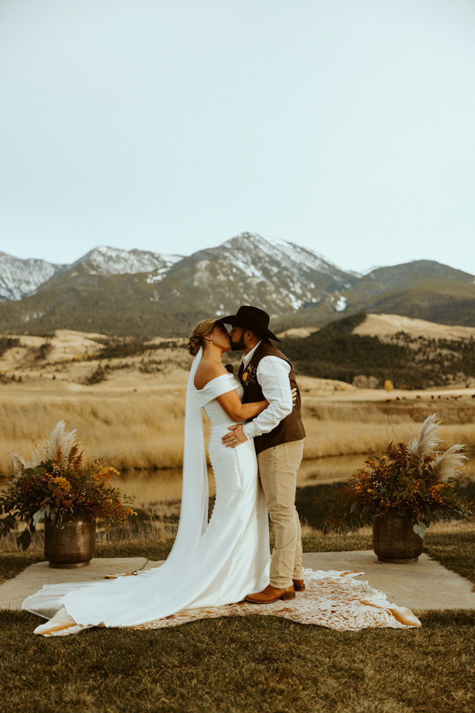 Bride and groom kissing after saying i do