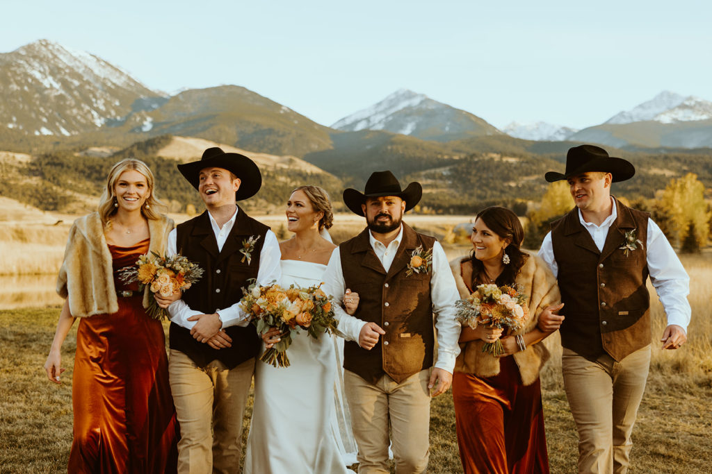 bridal party posing for photos after montana paradise velley wedding
