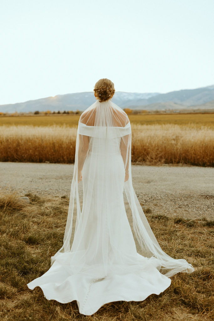 bride looking at the mountains during wedding photos