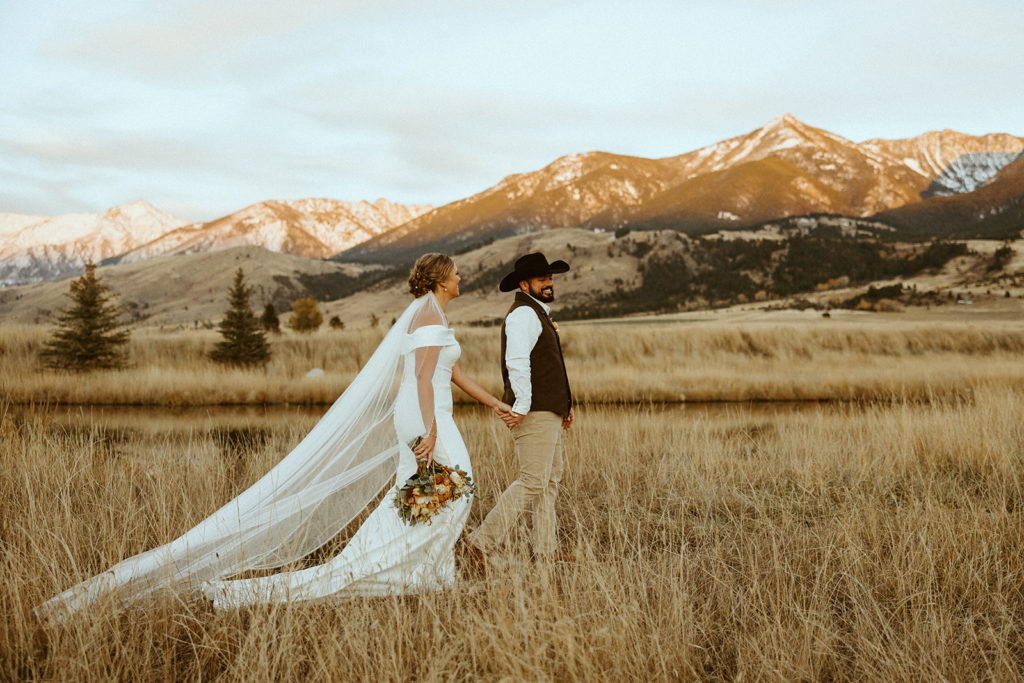 bride and groom posing for wedding photos in montana paradise valley