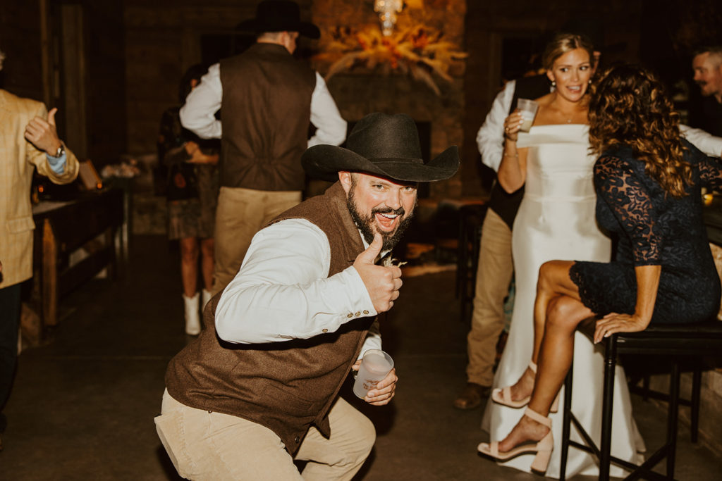 groom dancing during wedding reception
