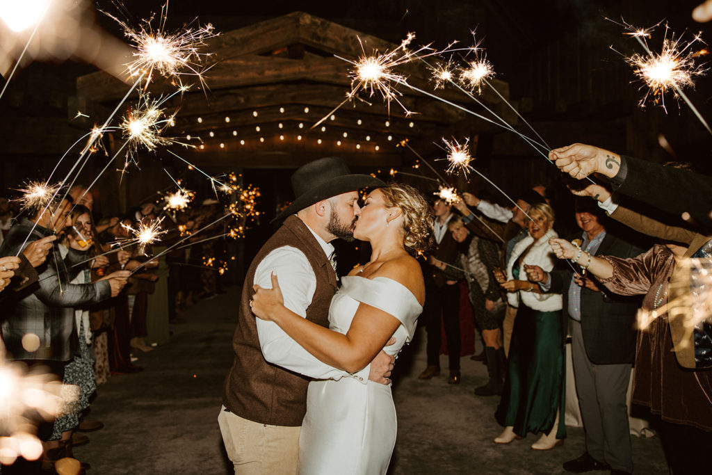 Bride and grooms sparkler exit after montana paradise valley wedding