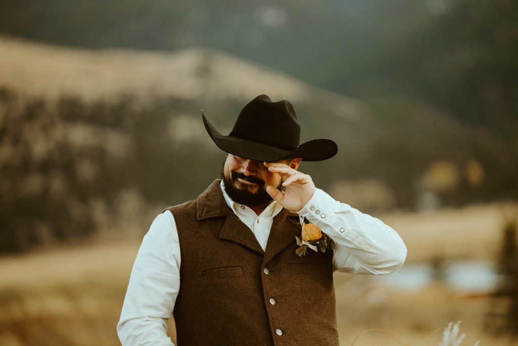 groom getting emotional after seeing bride walking down the aisle during montana paradise valley wedding