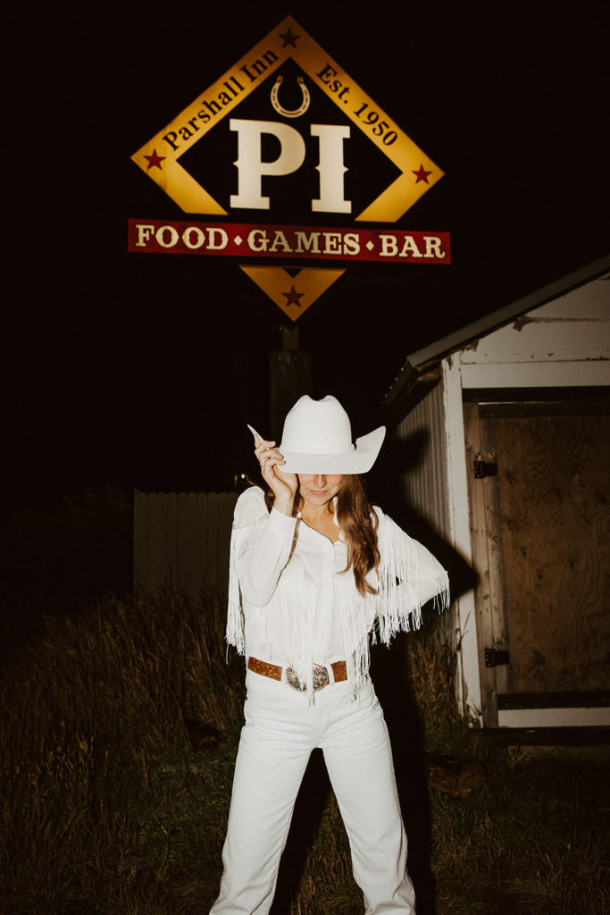 Bride in white western cowgirl outfit