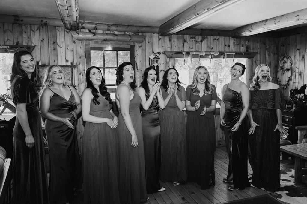 Brides first look with bridesmaids before wedding on a ranch