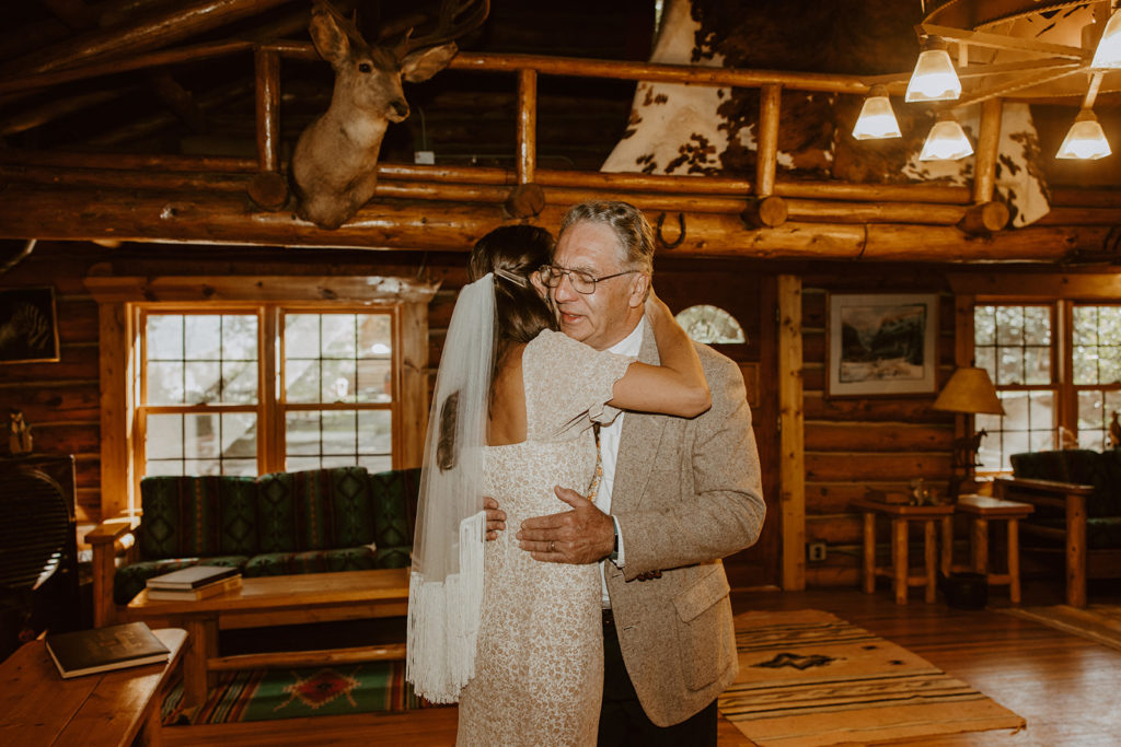 Brides first look with her father before wedding on a ranch