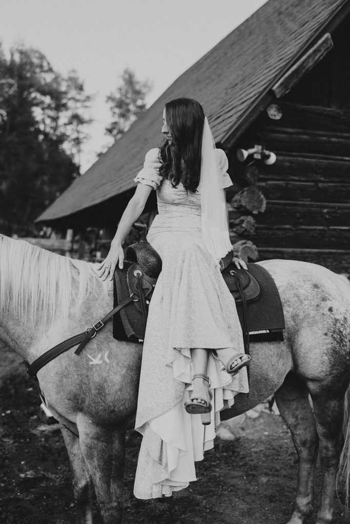 Bride sitting on a horse for wedding at a ranch portraits