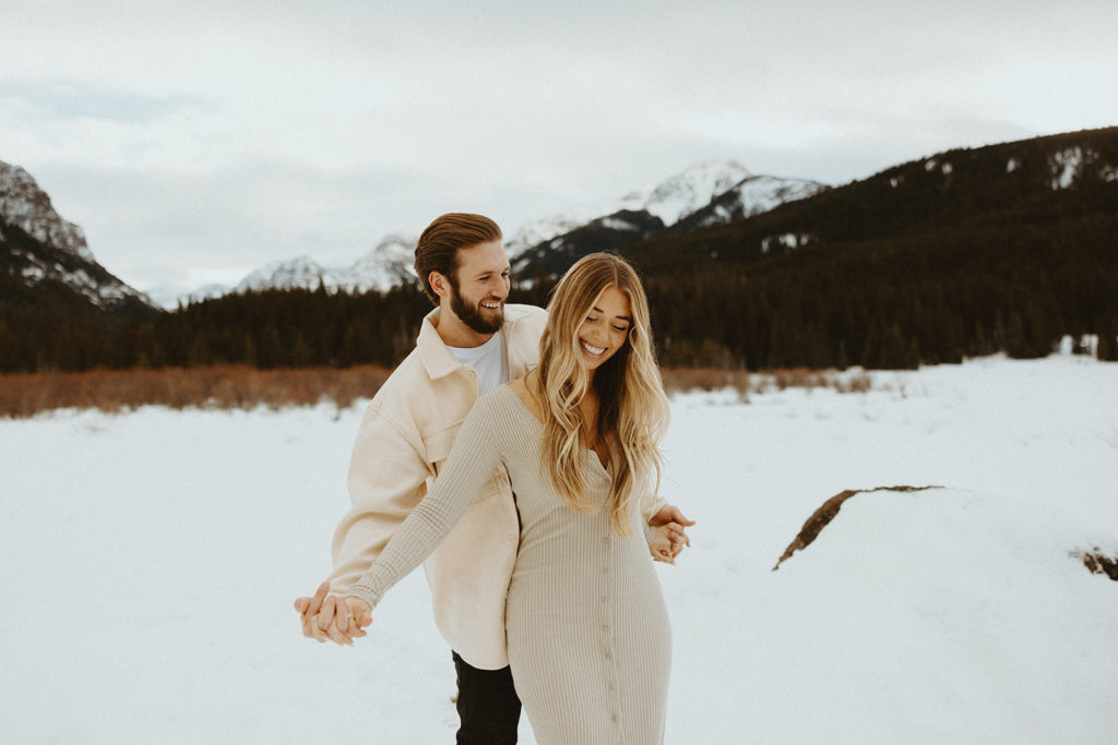 Couple posing for Bozeman Montana winter engagement photos